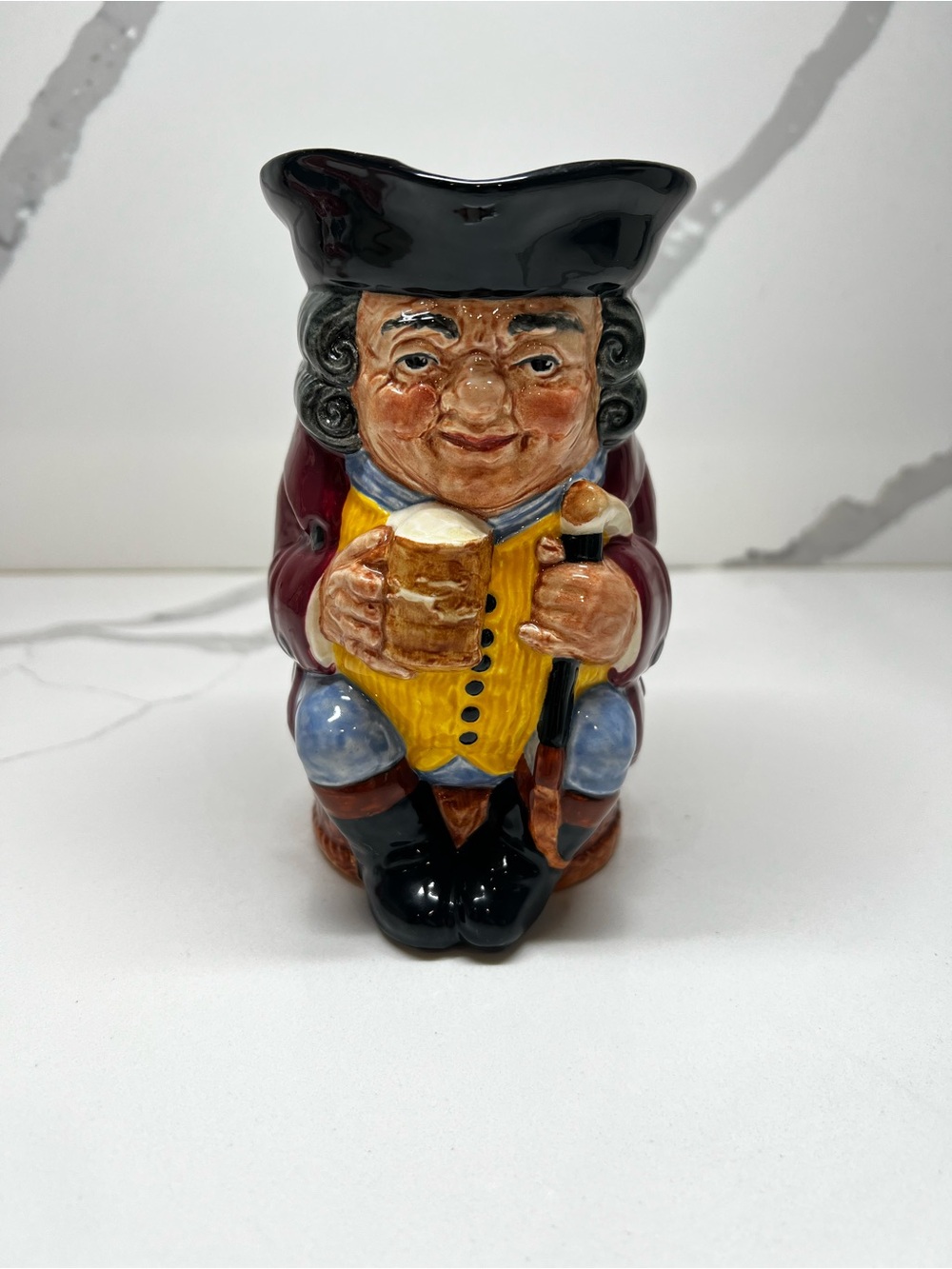 Royal Doulton Toby Jug in Black, Yellow, Burgundy and Blue